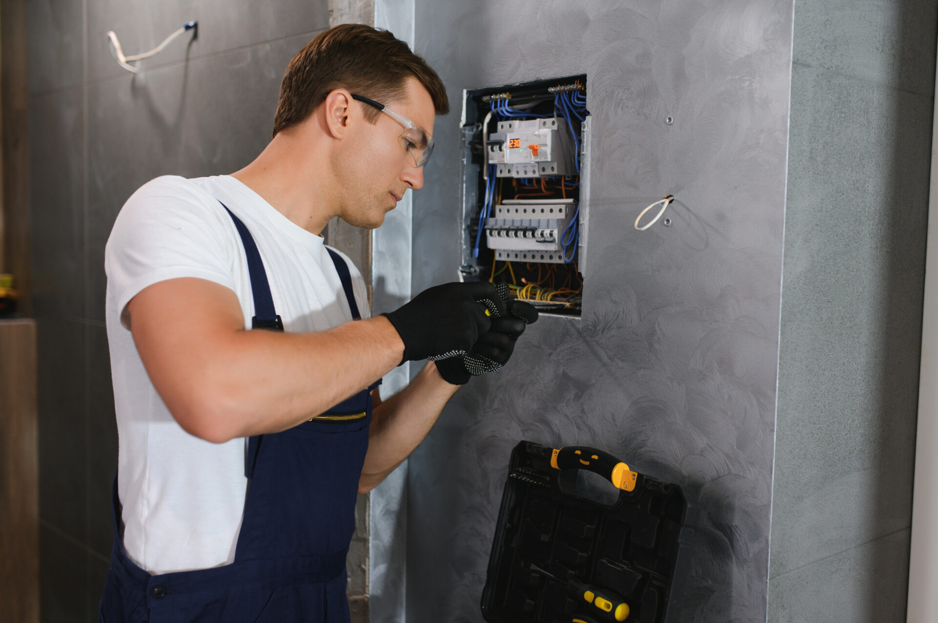 Electrician worker at work on an electrical panel